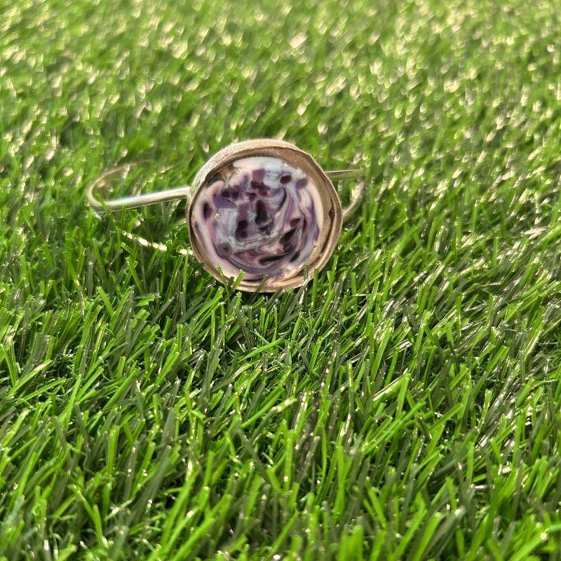 Ball Marker Wide Split Bracelet on grass displays the bracelet by itself